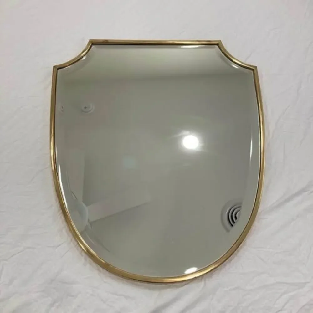 Pottery Barn brass shield shaped wall mirror